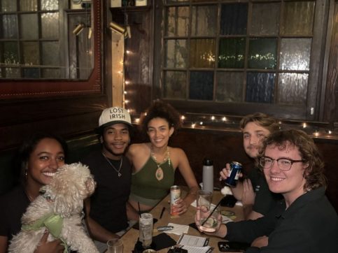 Friends enjoying a weekly pub trivia night at Tom Bergin's Irish Pub in Fairfax, Los Angeles